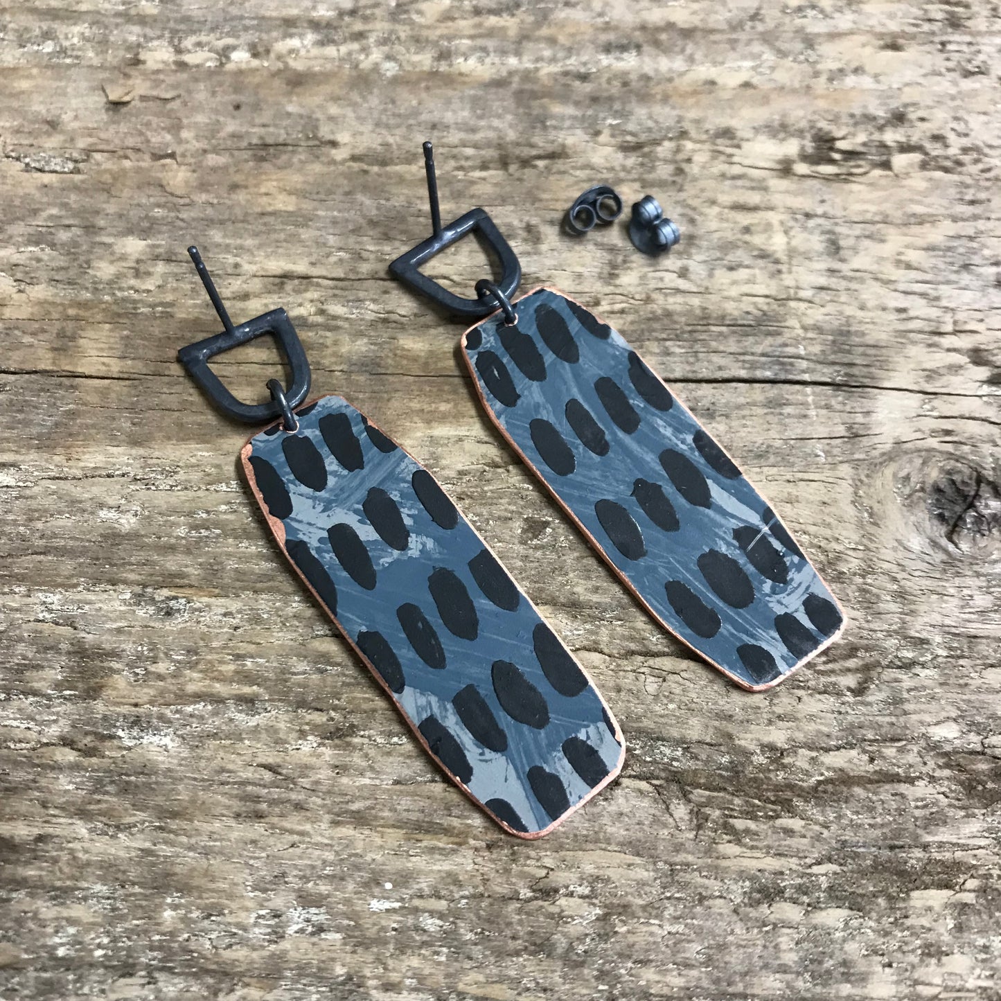 Dark playful painterly earrings with yellow X
