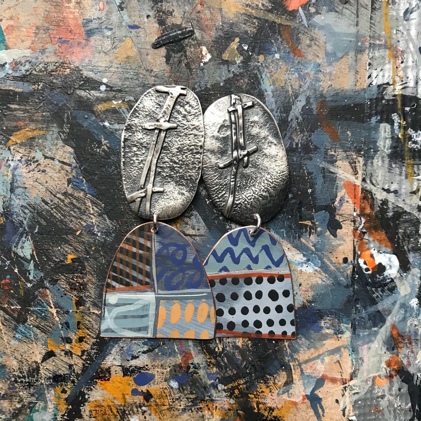 the evocative woven ON THE CUSP earrings with black spots