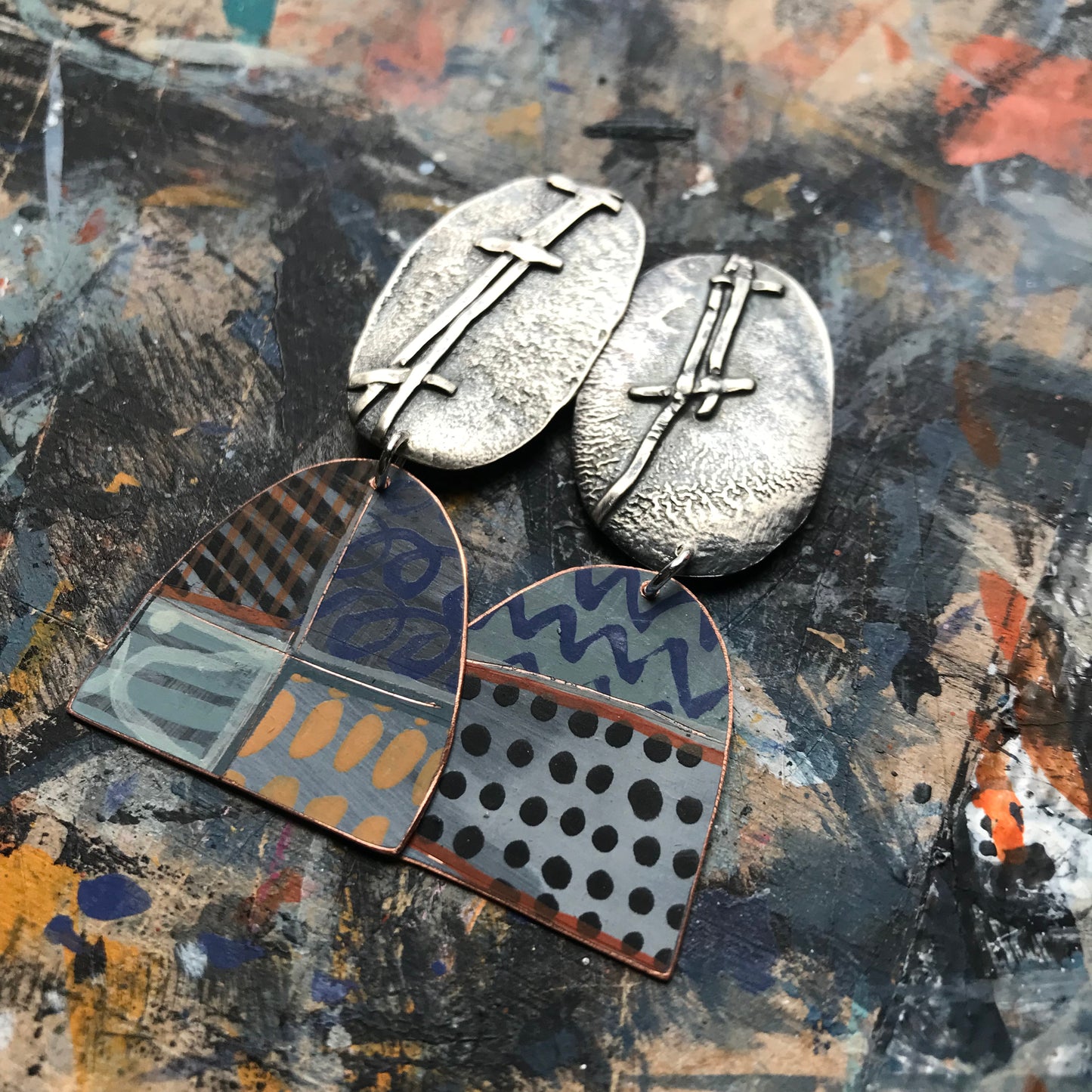 the evocative woven ON THE CUSP earrings with black spots