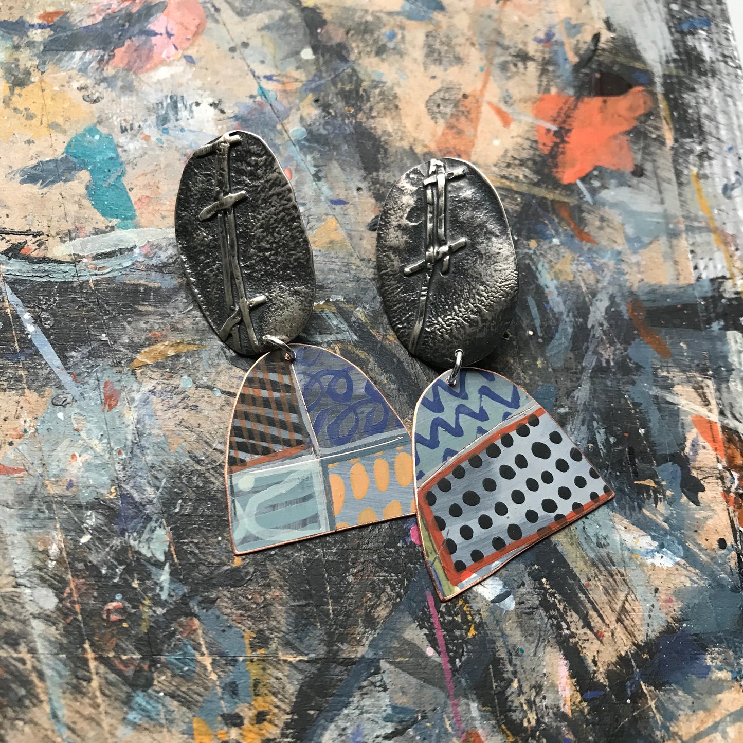 the evocative woven ON THE CUSP earrings with black spots