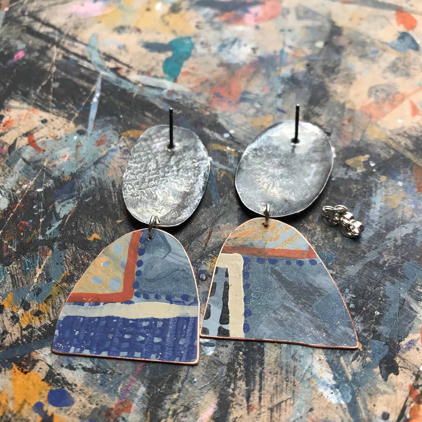 the evocative woven ON THE CUSP earrings with black spots