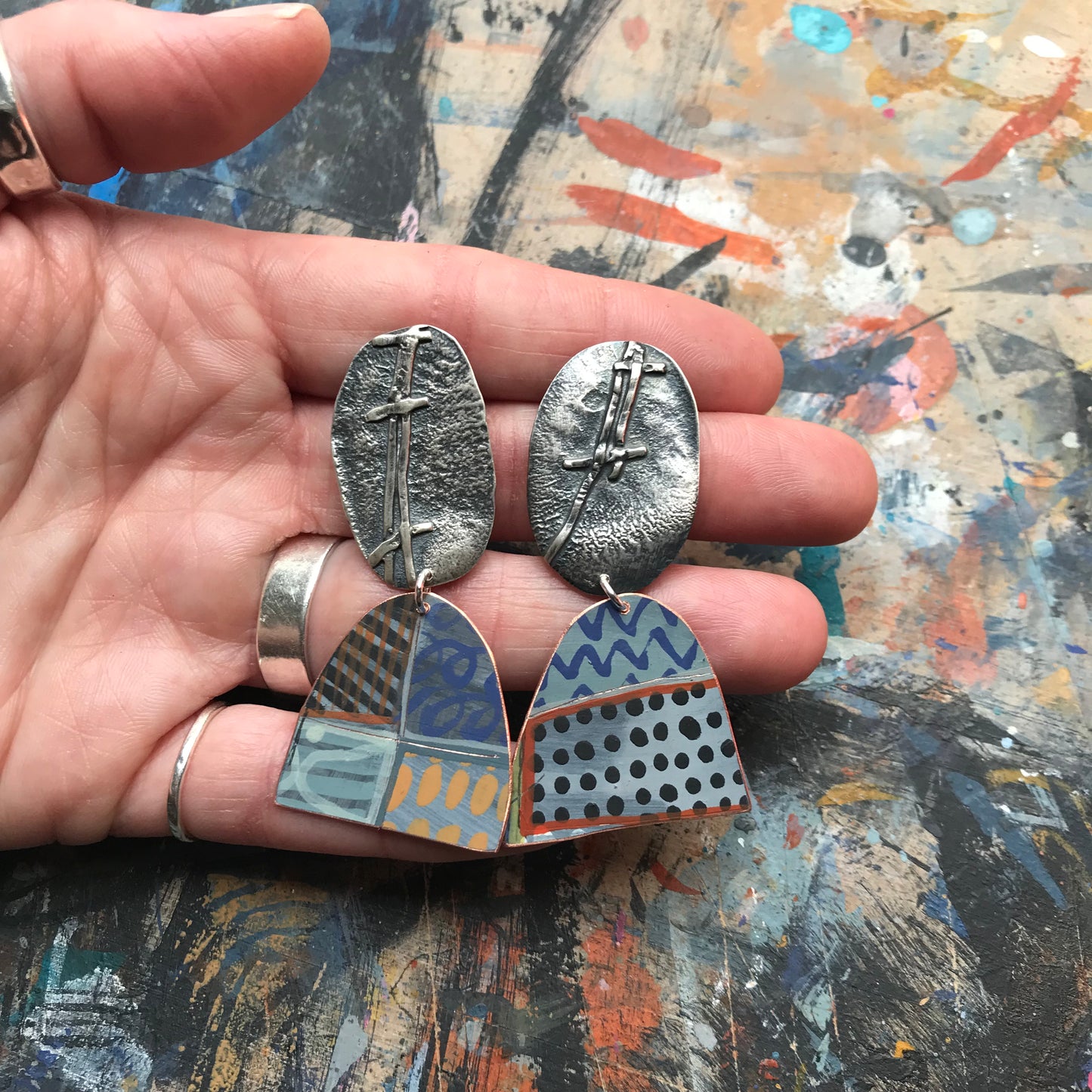the evocative woven ON THE CUSP earrings with black spots