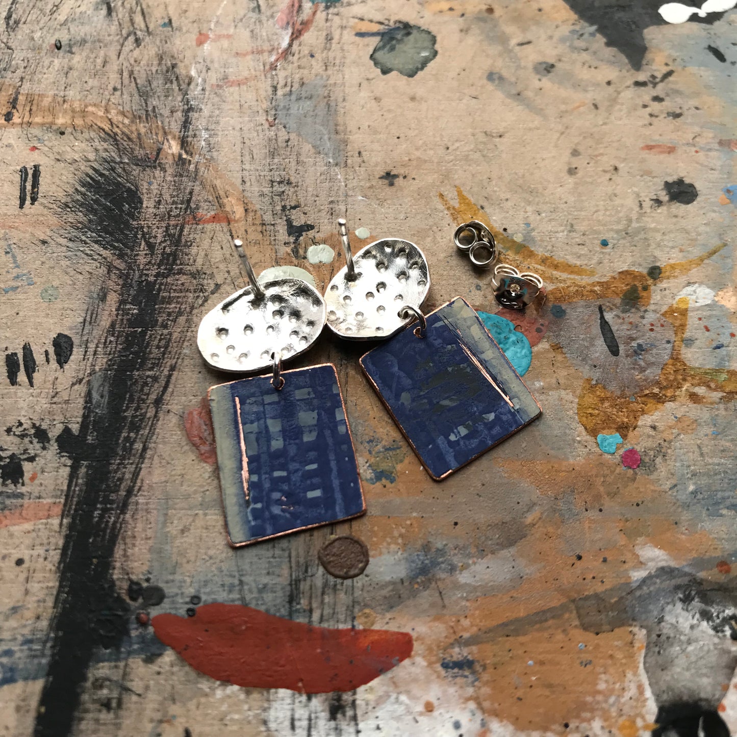 the expressive ON THE CUSP earrings with textured ovals