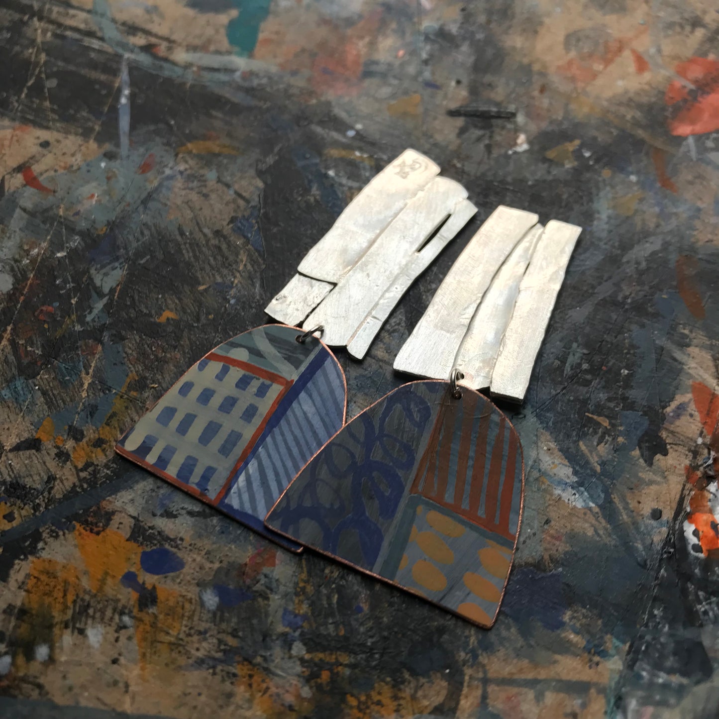 the strikingly creative ON THE CUSP earrings