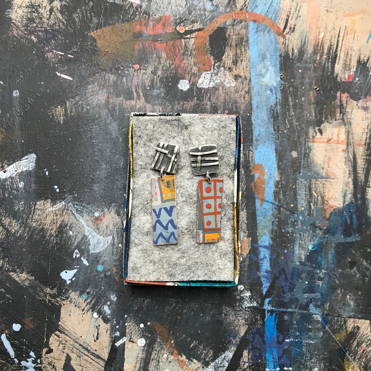 the powerful dark & woven ON THE CUSP earrings
