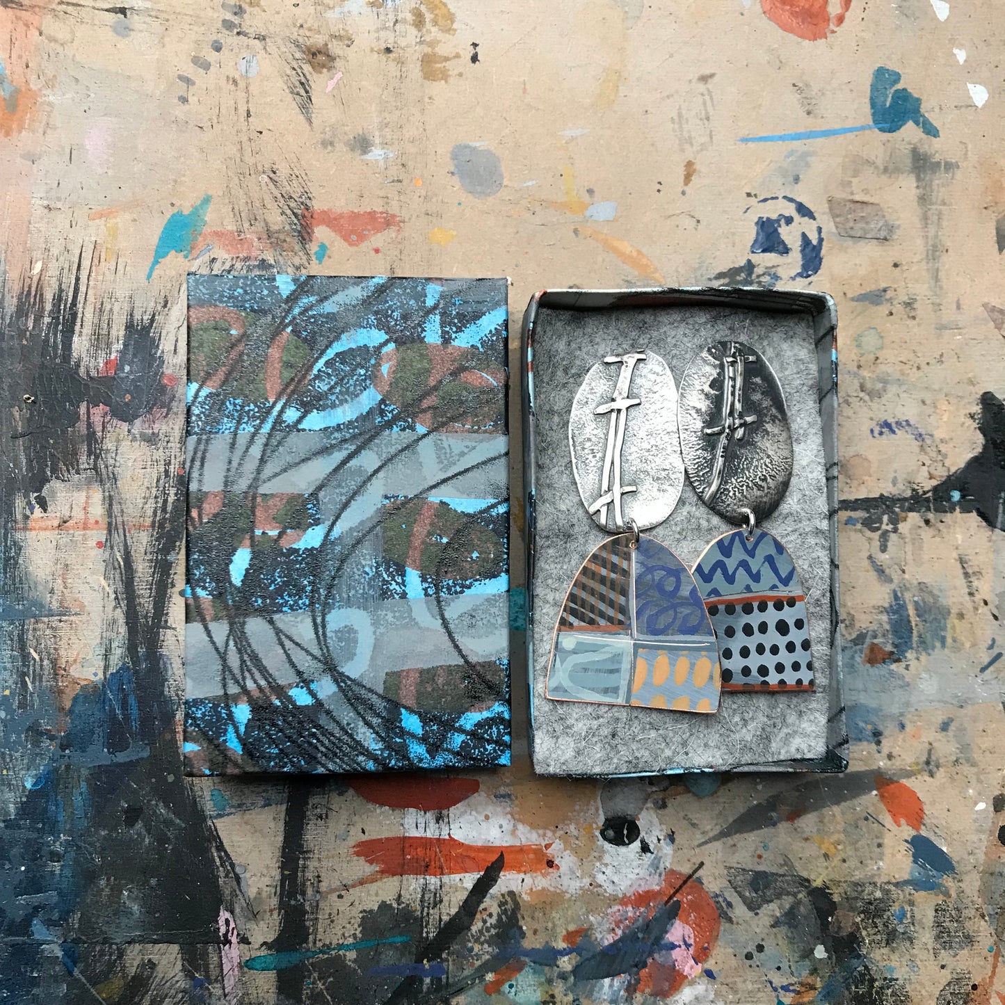 the evocative woven ON THE CUSP earrings with black spots