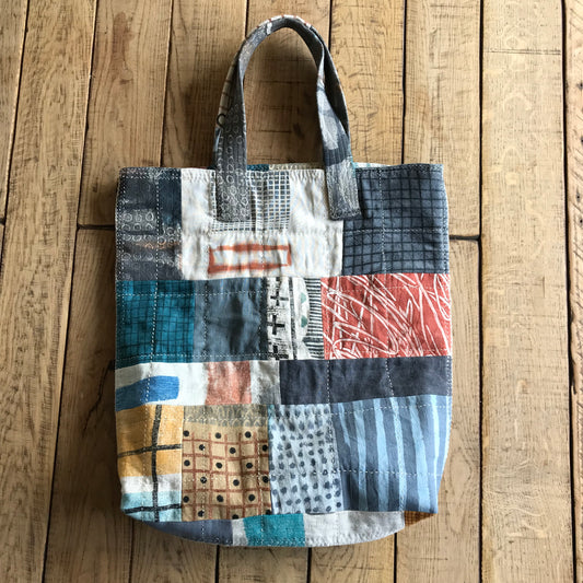 the PATCH WORK GRID WORK bag