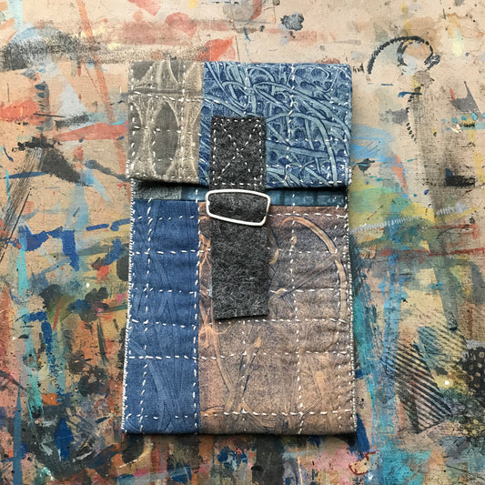 the SLIM PATCHWORK pouch with silver buckle